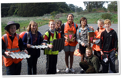 Sherwood School kids getting ready to put Lizard habitats out